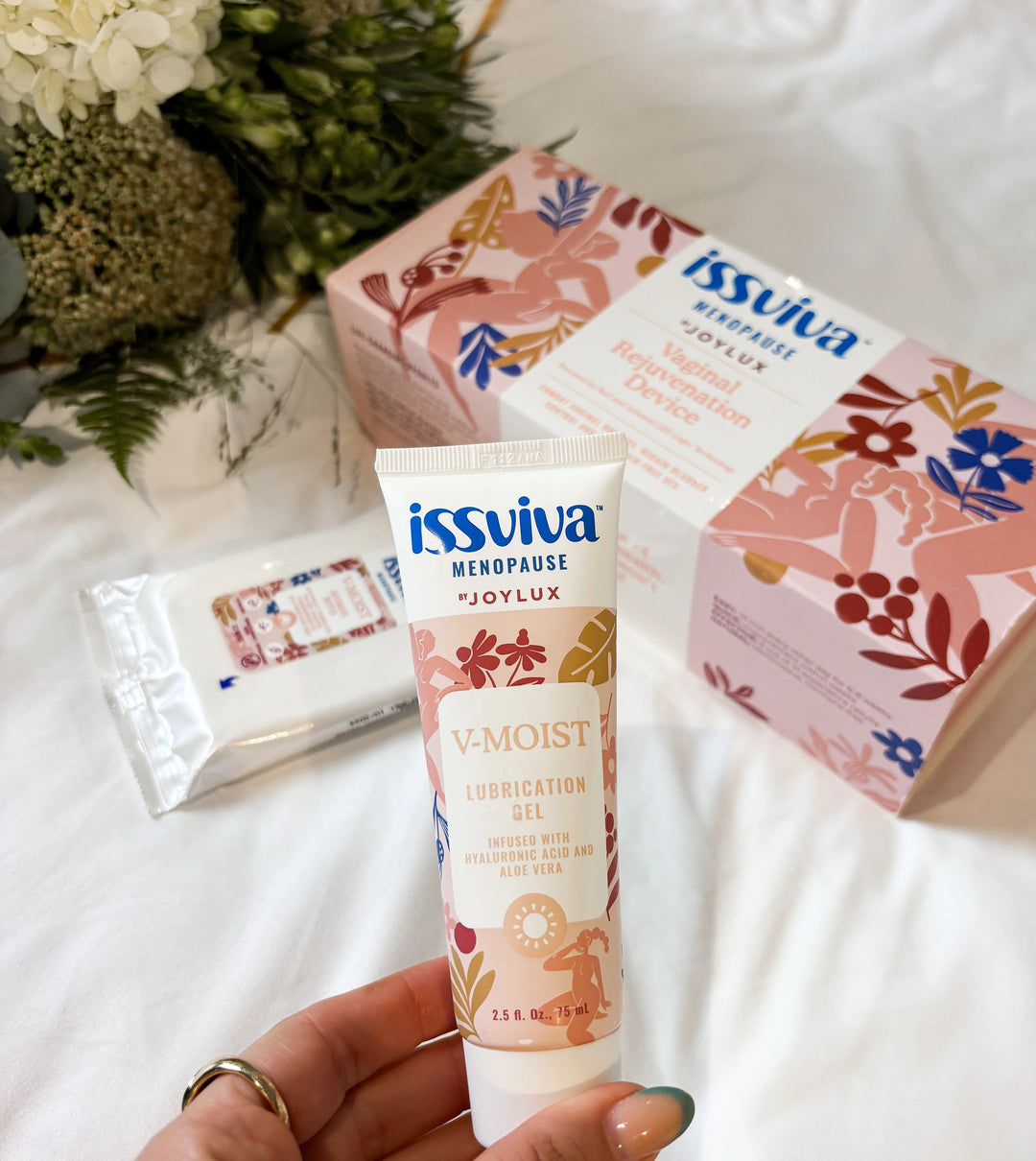 Woman holding Issviva product outdoors – promoting natural menopause support through daily wellness routines
