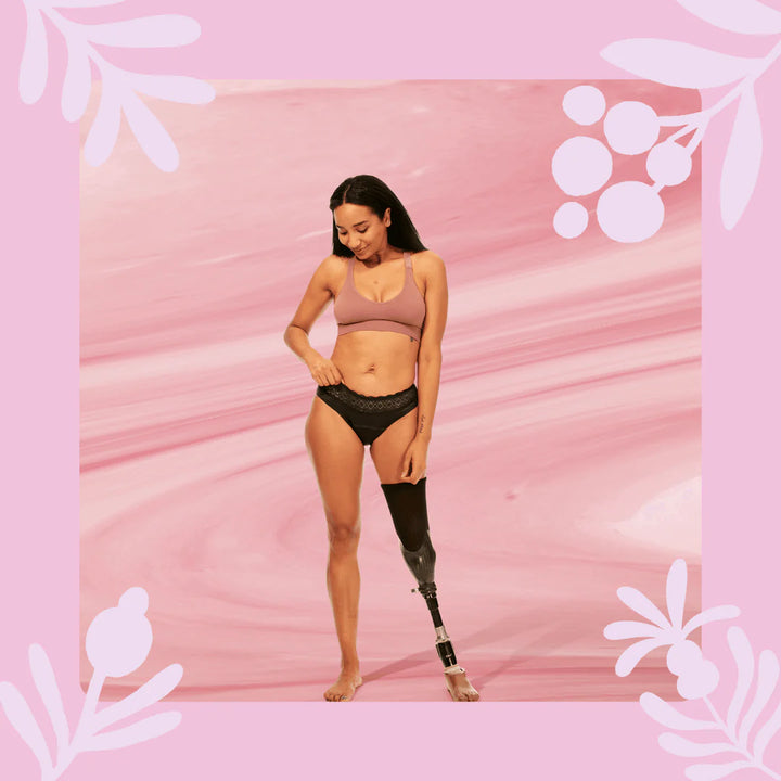 Woman wearing Bodyform Moderate Flow Washable Period Pants in black color, against a soft background.