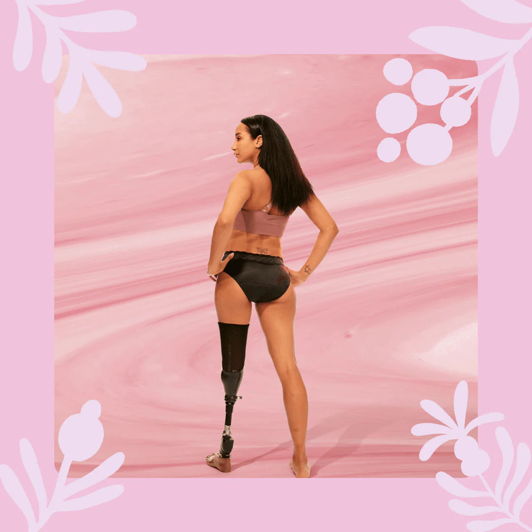 Woman wearing Bodyform Moderate Flow Washable Period Pants in black color, against a soft background.
