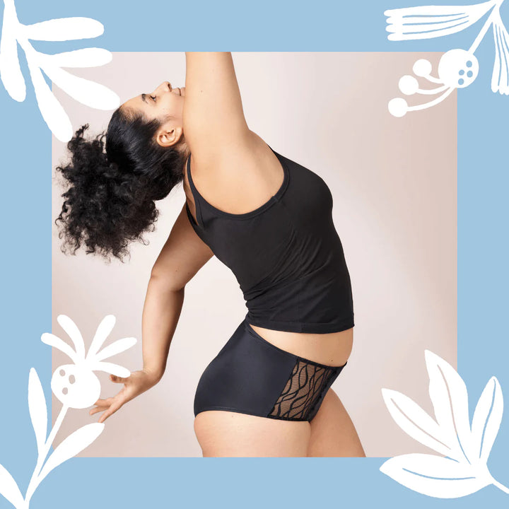 Woman wearing TENA Black Classic Brief Washable Incontinence Underwear, on a neutral background.