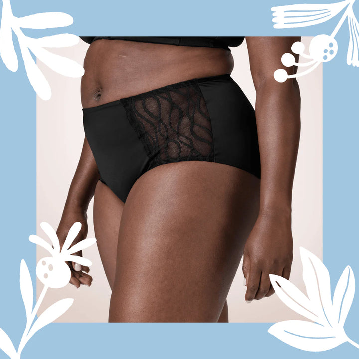 Woman wearing TENA Black Classic Brief Washable Incontinence Underwear, shown from waist to thighs on a neutral background.