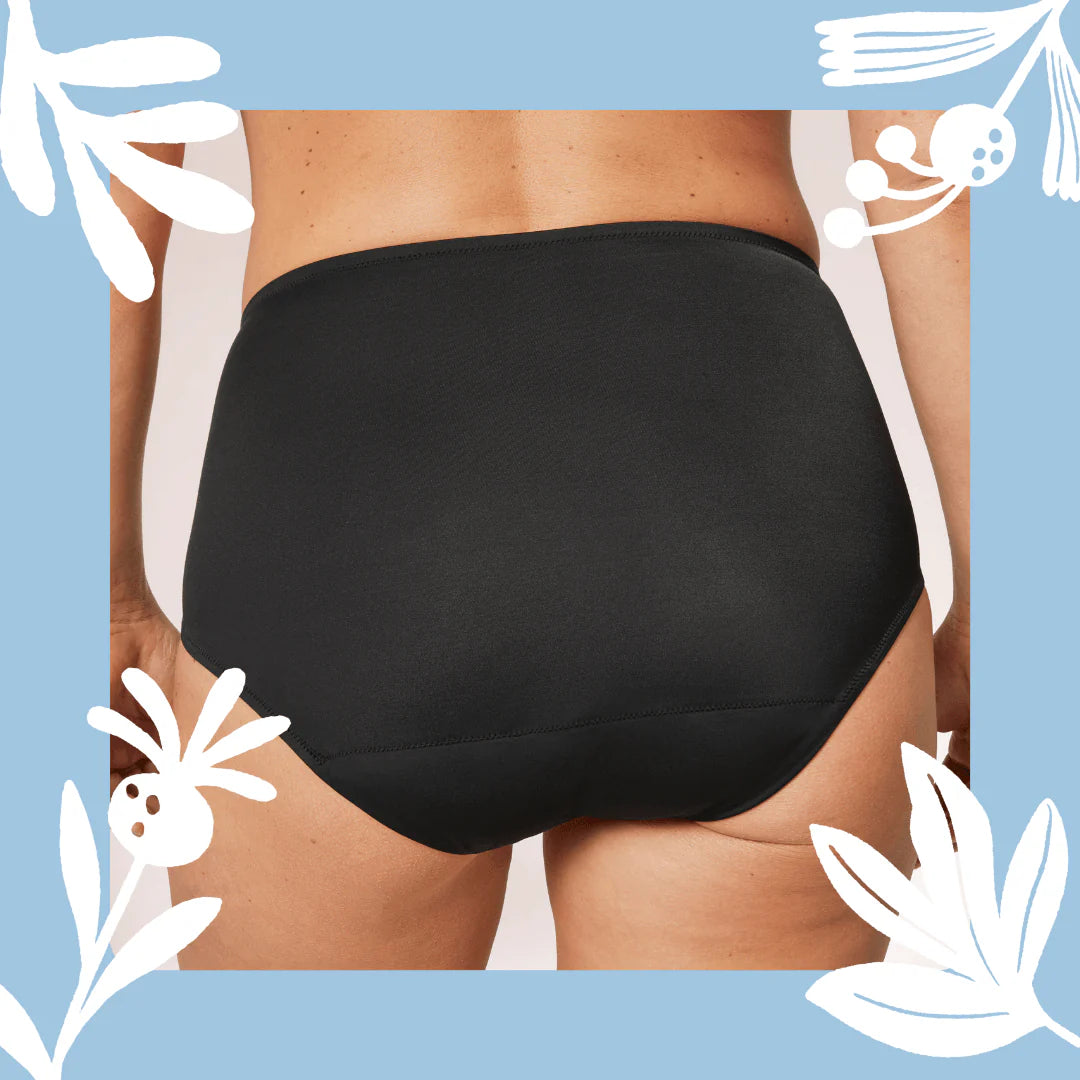 Woman wearing TENA Black Classic Brief Washable Incontinence Underwear, shown from waist to thighs on a neutral background.