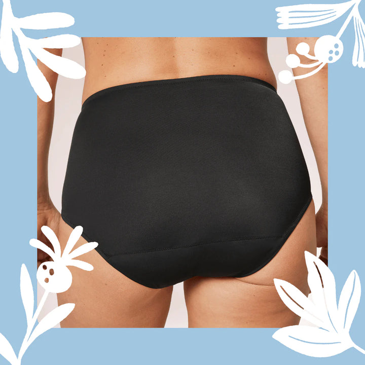 Woman wearing TENA Black Classic Brief Washable Incontinence Underwear, shown from waist to thighs on a neutral background.