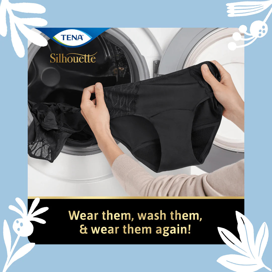 Hands holding TENA Black Classic Brief Washable Incontinence Underwear